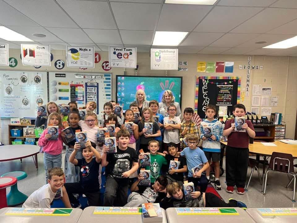 Third graders at Belleville Henderson receiving dictionaries from Watertown Elks Lodge #496